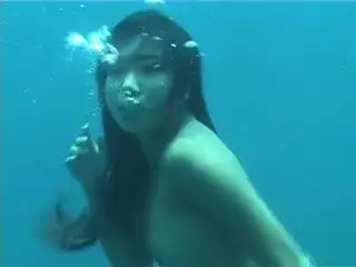 Cute Asian Woman Swimming Underwater in 4K