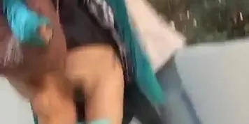 Girl in Green Sweater Caught Off Guard on Stairs